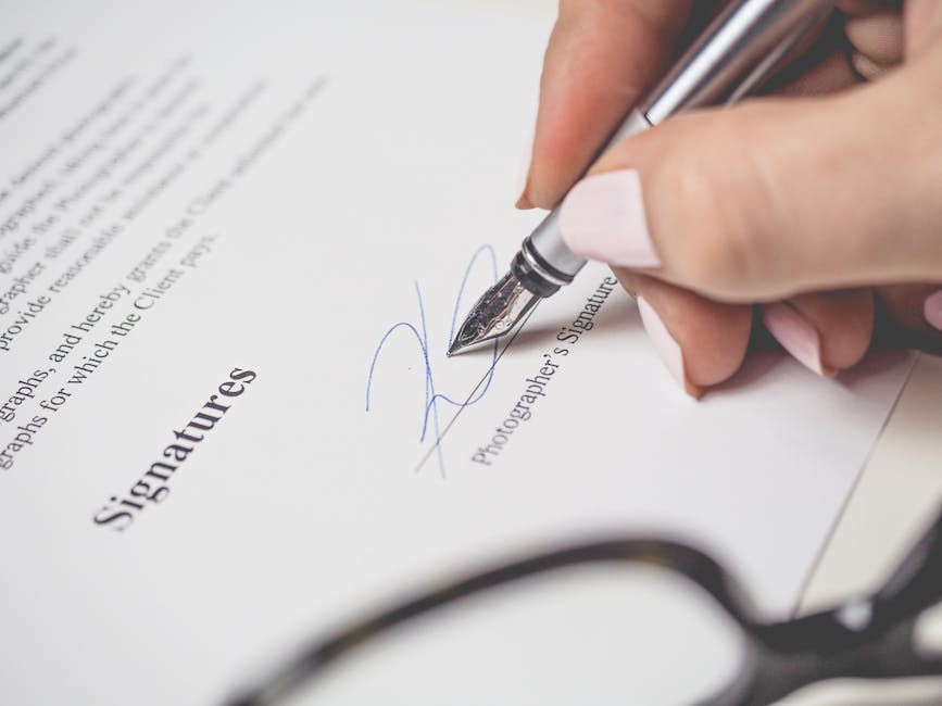 Close-up of a fountain pen signing a business note contract